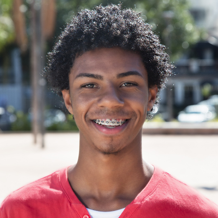 Young man with traditional braces in Long Beach, NY
