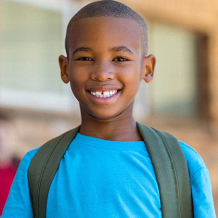 smiling child who could benefit from dental sealants in Long Beach