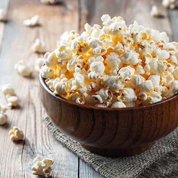 Close up of wooden bowl of popcorn