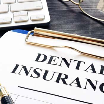 Dental insurance paperwork for the cost of dental implants in Long Beach