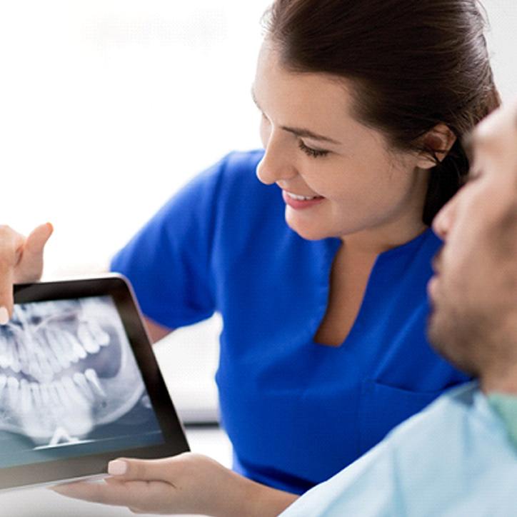 Orthodontist showing patient his X-ray