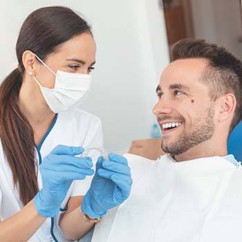 Orthodontist and patient discuss the cost of Invisalign in Long Beach