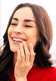 Woman rubbing her aching jaw
