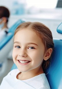 a child smiling during a dental visit near Lido Beach
