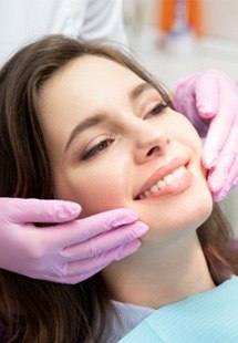 a patient smiling after undergoing cosmetic dentistry