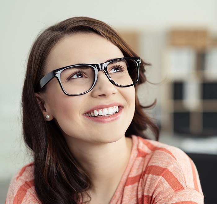 Young woman sharing smile after orthodontics treatment