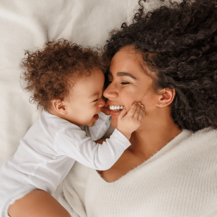 Mother smiling at baby