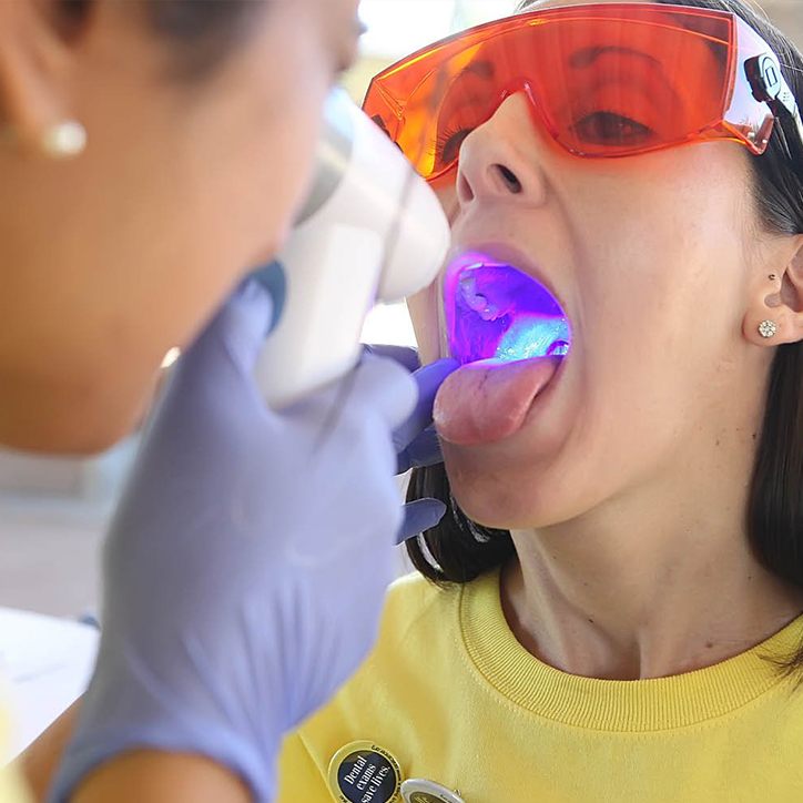 Patient receiving oral cancer screening