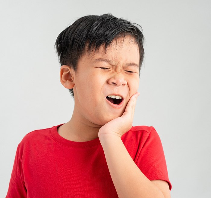 little kid in dental pain