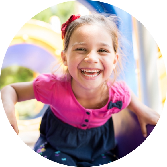 Little girl laughing after children's dentistry visit