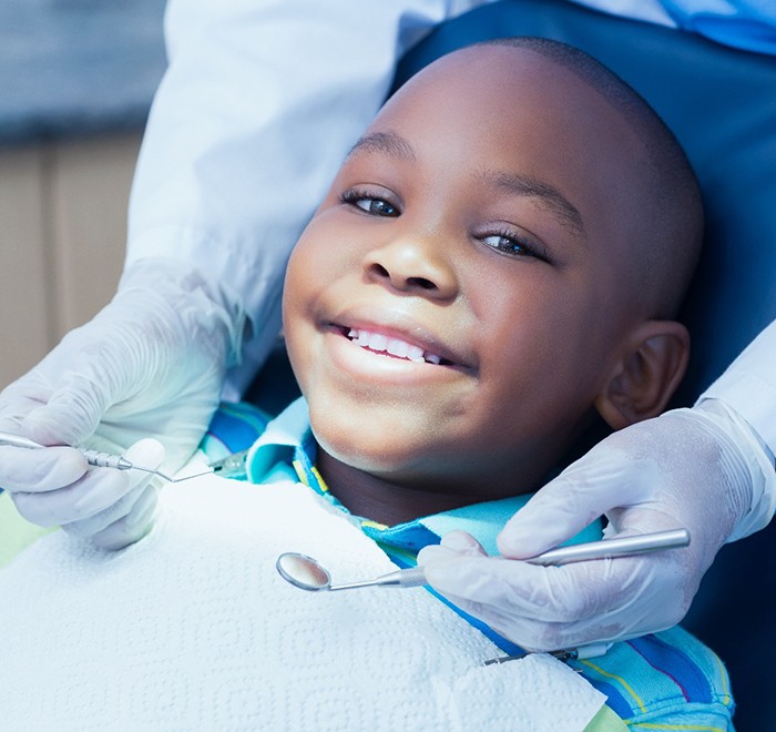 Child high-fiving dentist