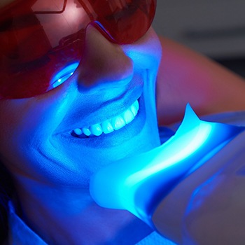 A woman getting teeth whitening
